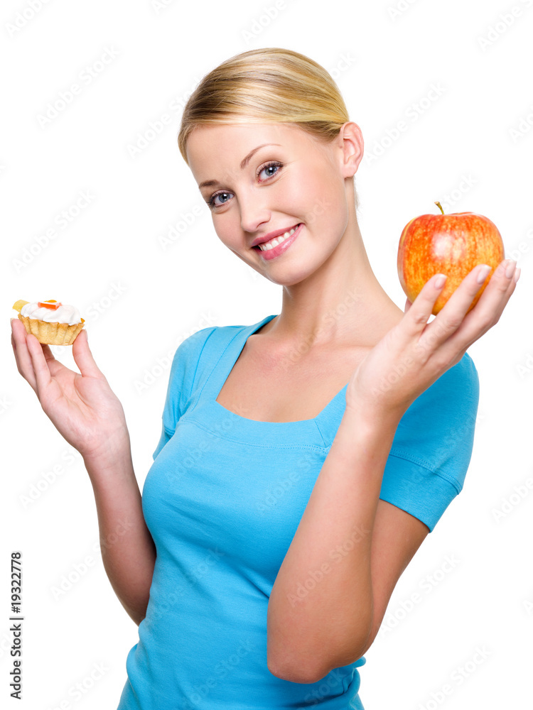 girl choose from sweet cake and fresh apple girl choose from sweet cake and fresh apple