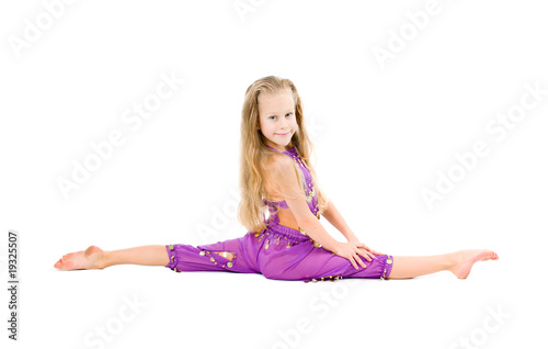 young girl doing gymnastics over white