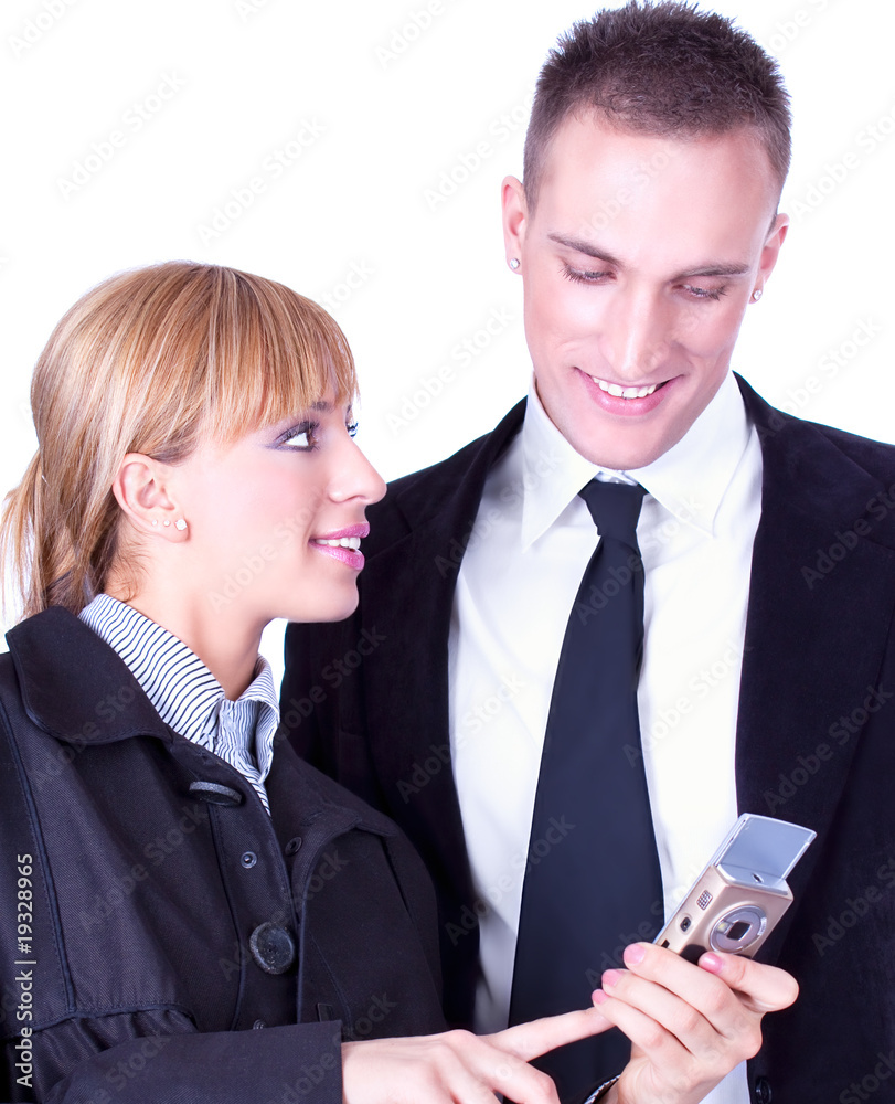 Portrait of young businesspeople sharing info on mobile phones