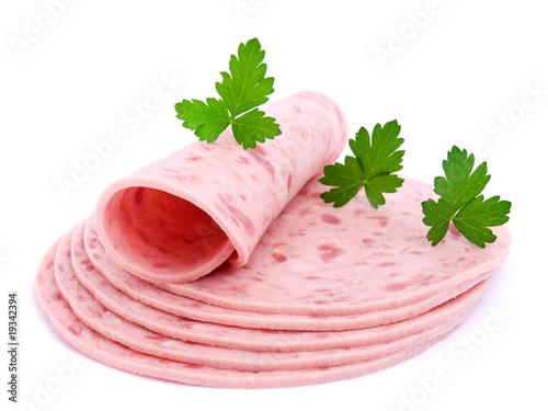 Slices of sausage, parsley on a white background