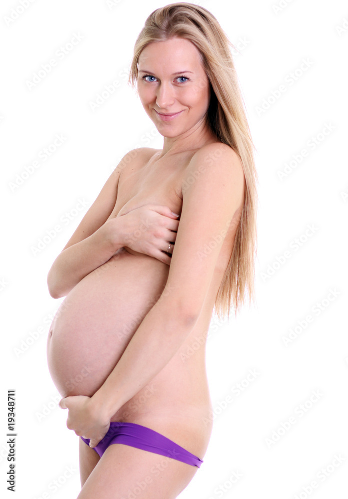 Fototapeta premium undressed pregnant female holding her breasts