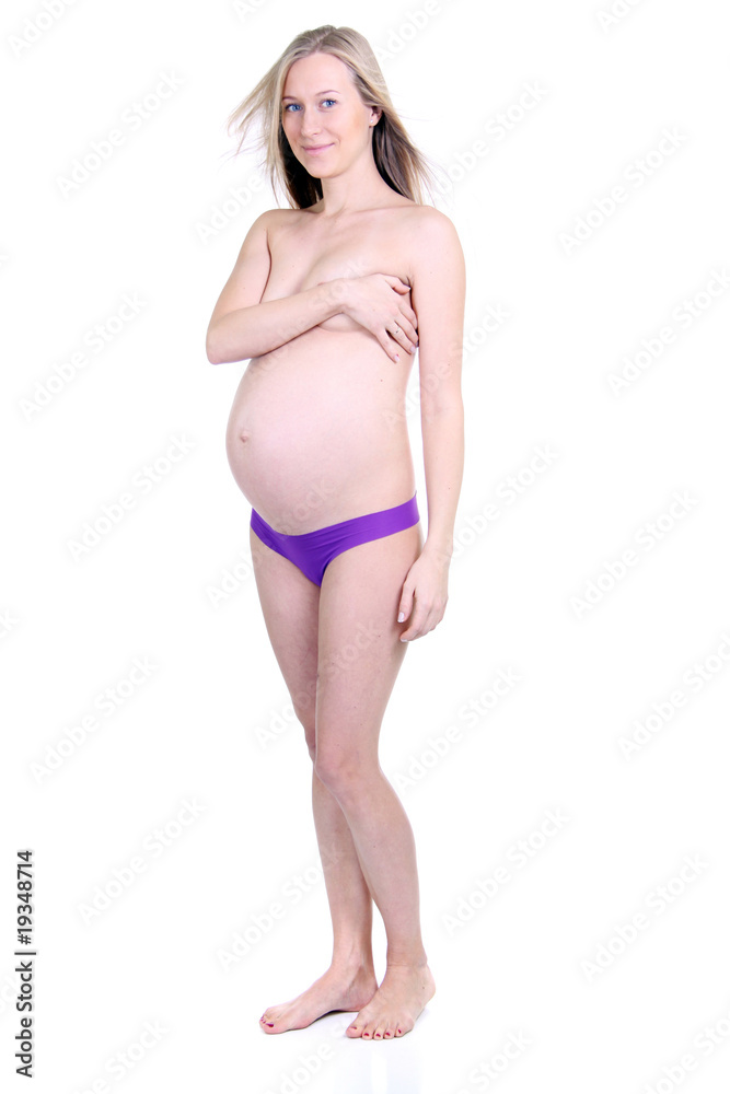 undressed pregnant female holding her breasts undressed pregnant female holding her breasts