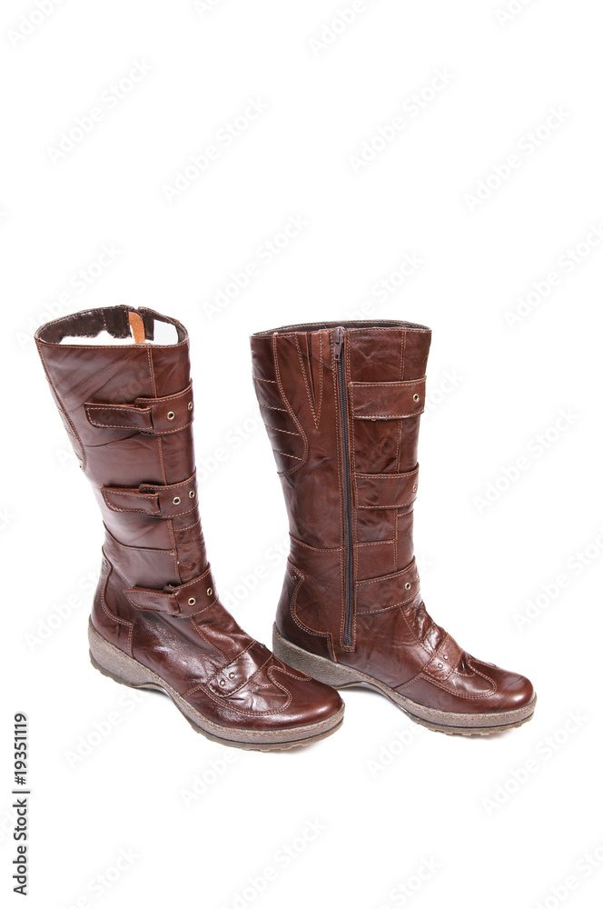 Stylish, brown modern boots on a white Stylish, brown modern boots on a white