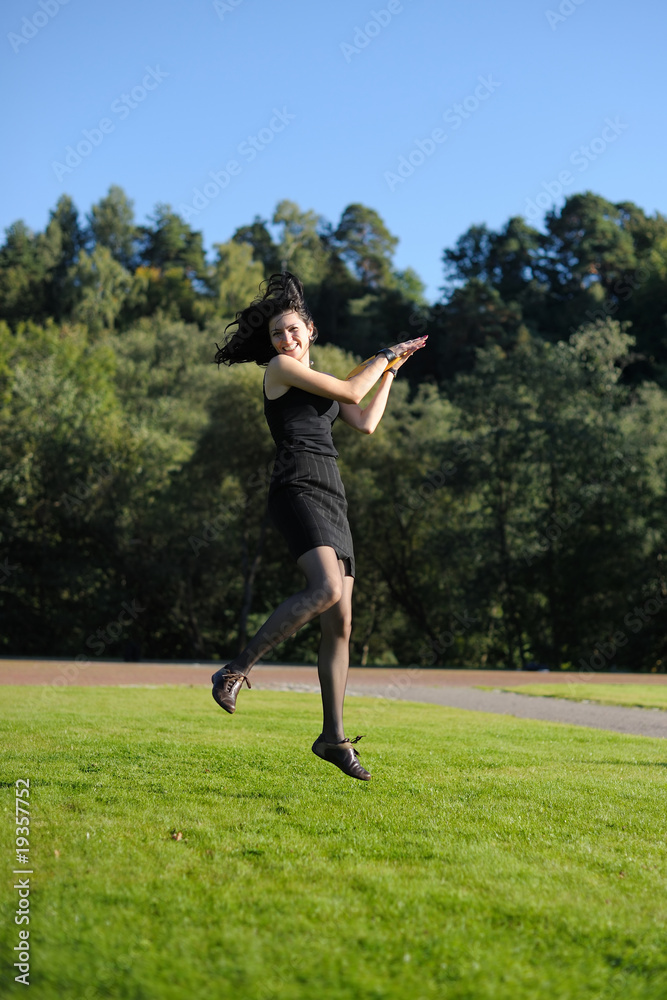 Young lady flying over lawn