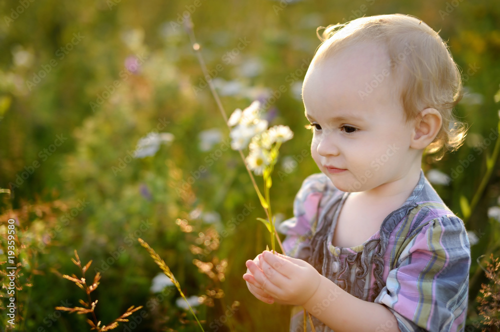 Little nice baby walking in a meadow Little nice baby walking in a meadow