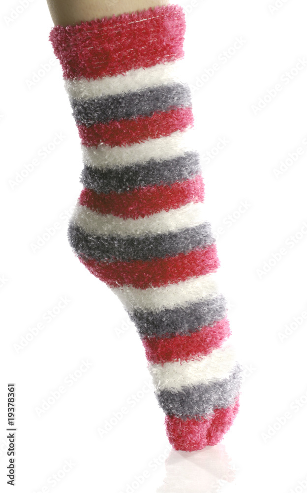 pointed toe with fuzzy red toe socks on with reflection Stock