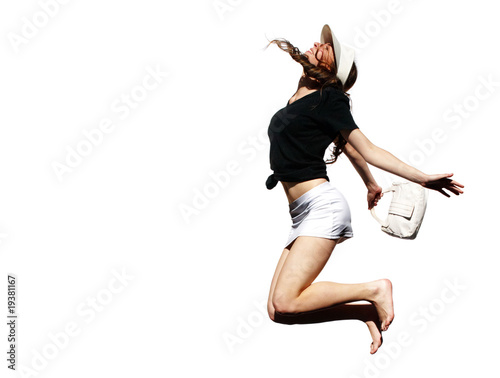 The young girl in a happy jump on a white background
