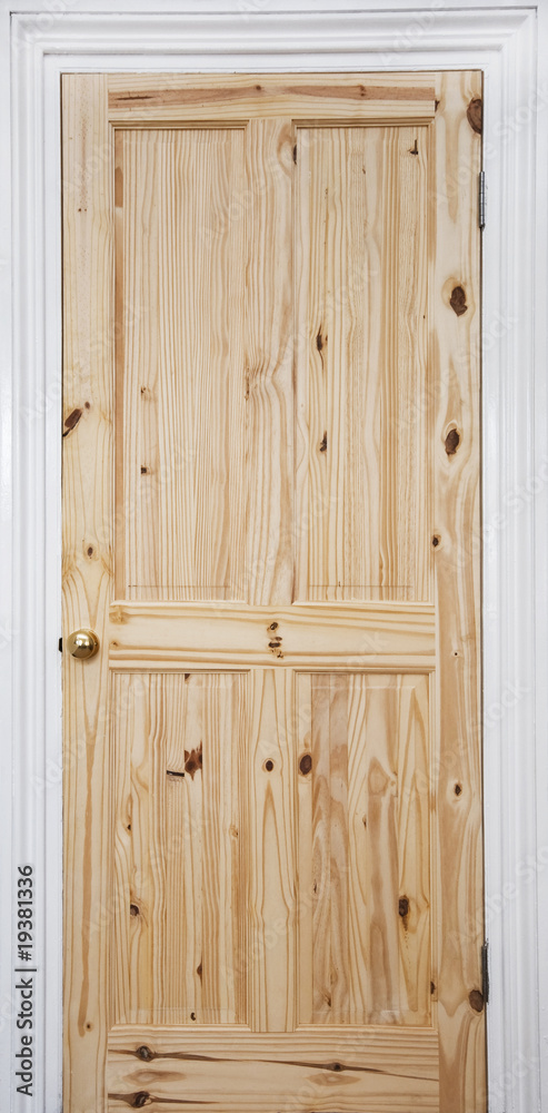 Wooden door with white frame