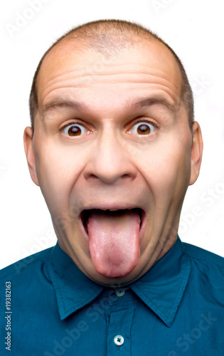 Adult man sticking tongue out