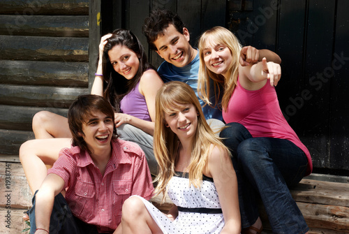 happy group of friends smiling outdoors