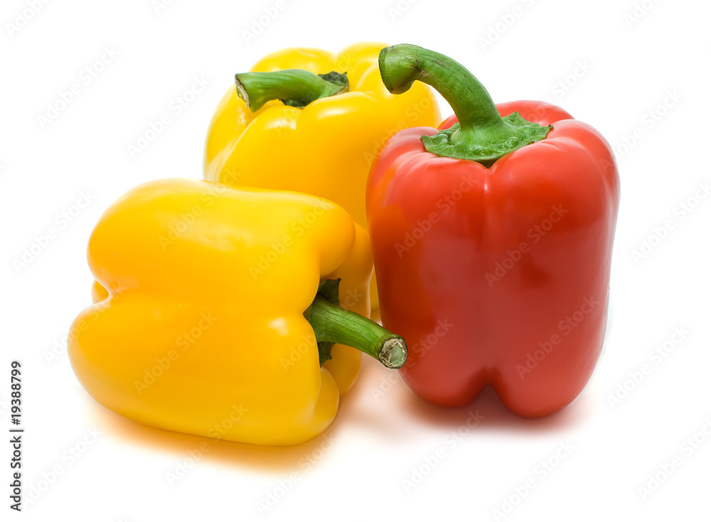 two yellow and red bell peppers isolated on a white background two yellow and red bell peppers isolated on a white background