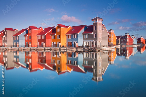 Colorful wooden houses near water photo