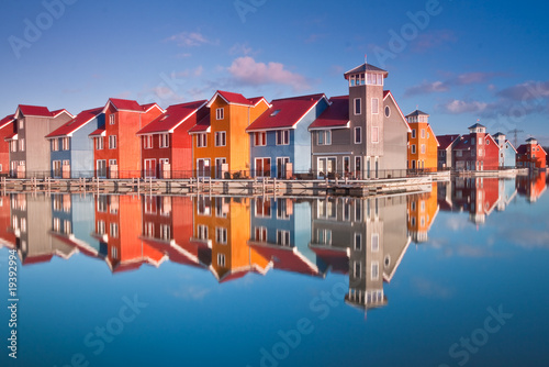 Colorful wooden houses near water