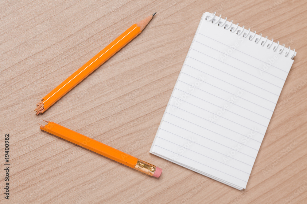 broken pencil and notepad broken pencil and notepad