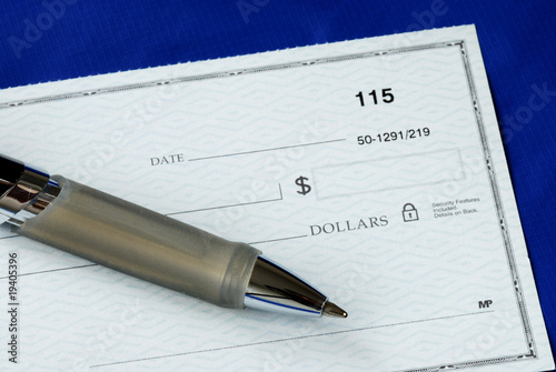 Fotografija Write the dollar amount on the check isolated on blue