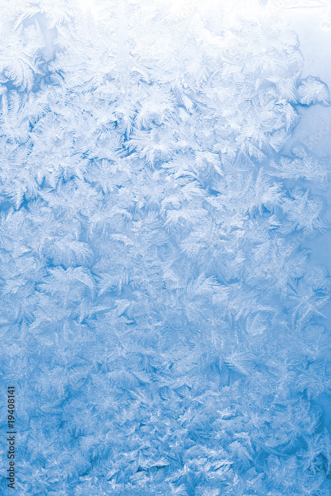 Fototapeta premium Light blue frozen window glass