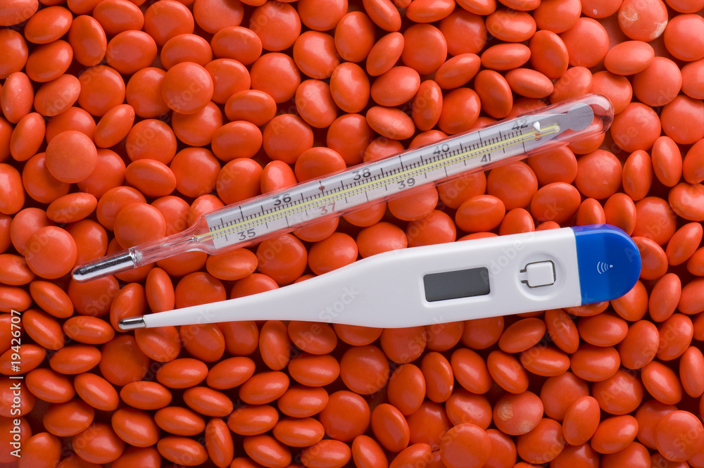Medical Tablets and thermometer macro Medical Tablets and thermometer macro