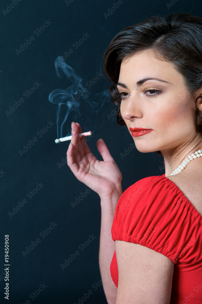 Obraz premium Beautiful Model in red smoking