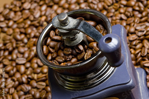 detail of coffee mill with coffee beans photo