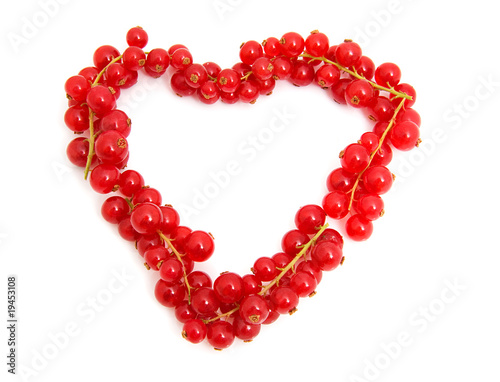 red berries in the shape of hearts over white background