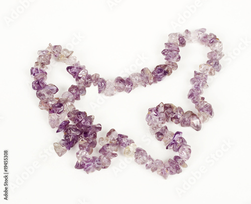 Amethyst necklace over white background