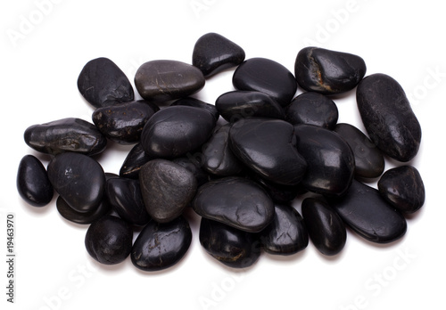 Fotografia Heap of black pebbles isolated on white background