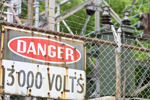 Danger sign in front of high voltage equipment