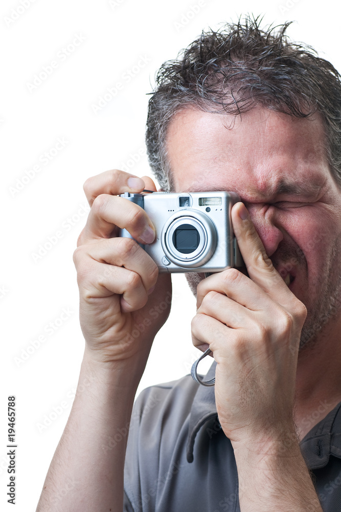 Man shooting with small digital camera on white Man shooting with small digital camera on white
