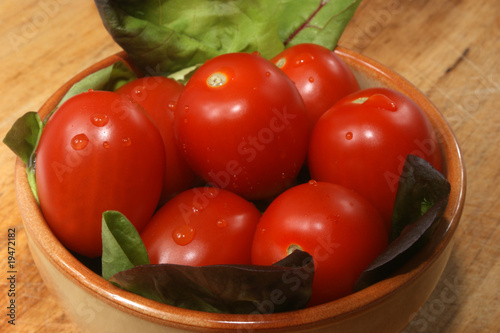 some organic plum tomato in a bowl