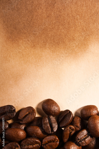 coffee beans on old paper © Kirill Polovnoy