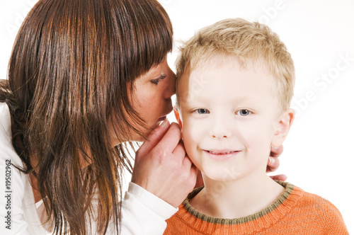 mother and son whispering