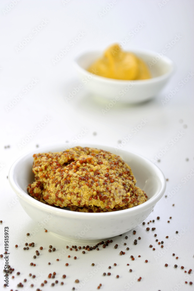 some organic mustard in a white bowl some organic mustard in a white bowl