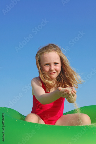 happy kid playing on beach photo