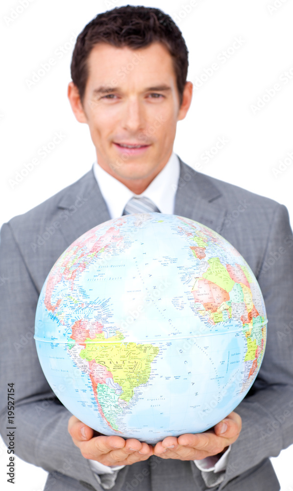 Assertive businessman holding a terrestrial globe Assertive businessman holding a terrestrial globe