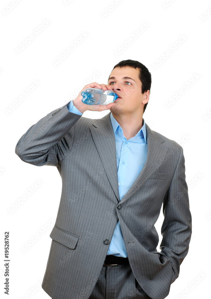 Businessman drinking water from plastic bottle Businessman drinking water from plastic bottle