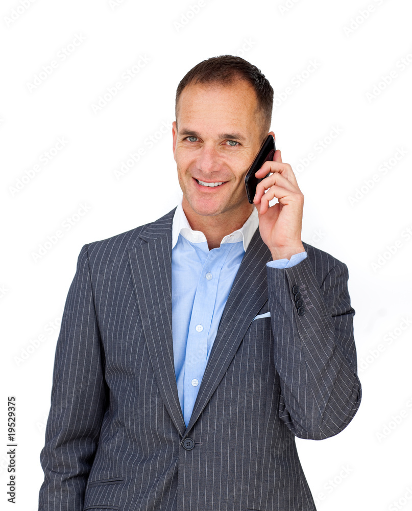 Charismatic attractive businessman using a mobile phone Charismatic attractive businessman using a mobile phone