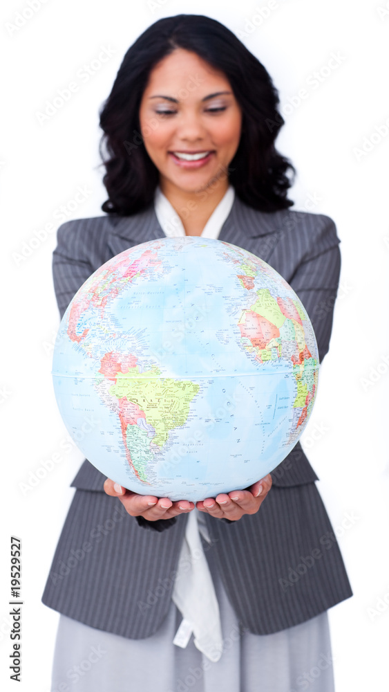 Ethnic businesswoman smiling at global business Ethnic businesswoman smiling at global business