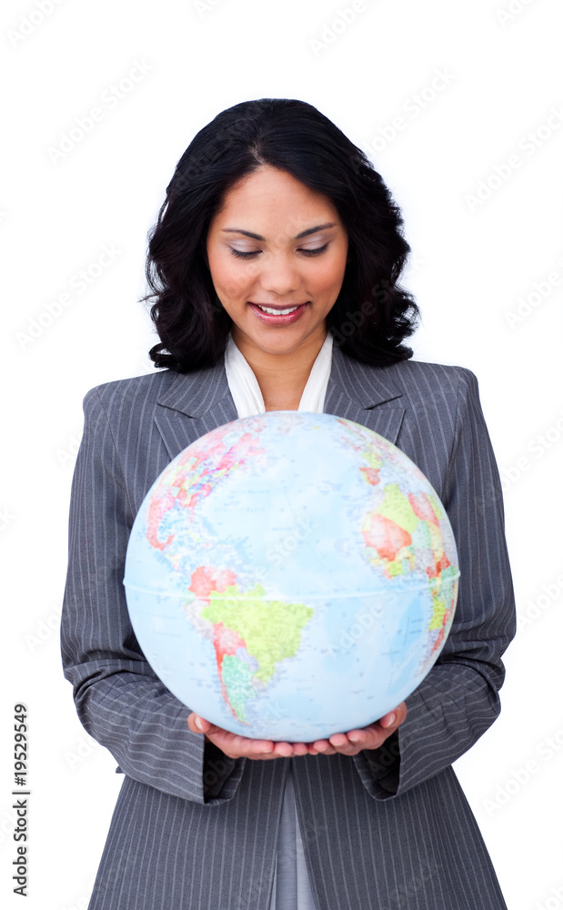 Confident ethnic businesswoman smiling at global business Confident ethnic businesswoman smiling at global business
