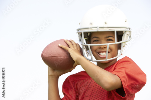 Young Boy Playing American Football