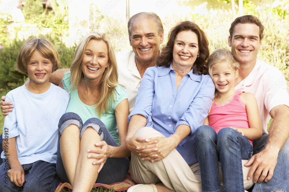 Fototapeta premium Extended Group Portrait Of Family In Garden