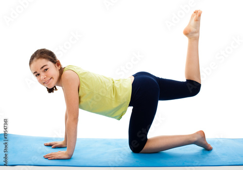 Active girl exercising isolated on white background