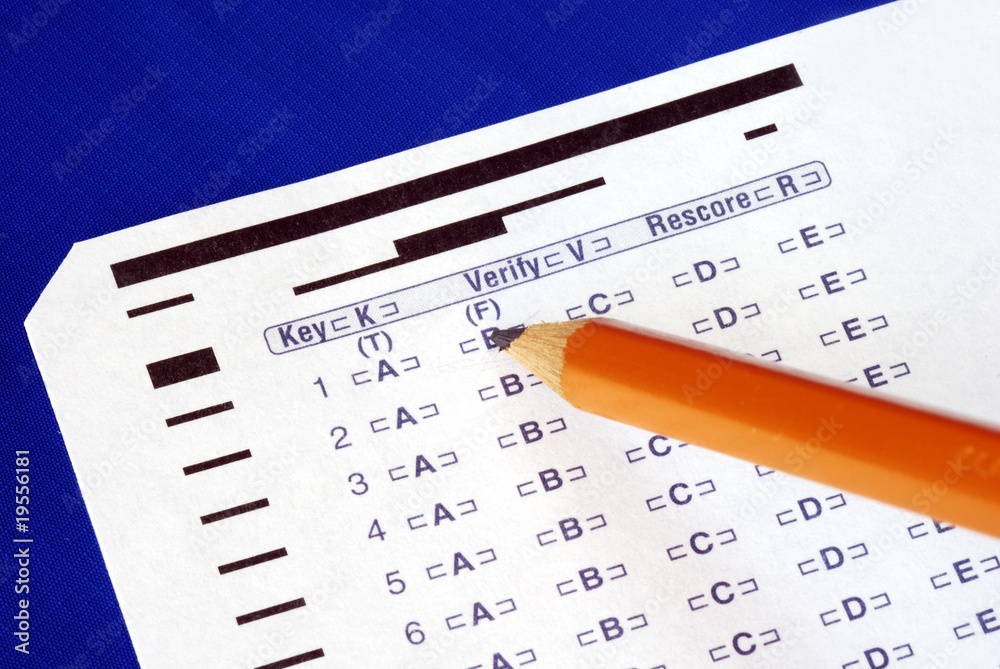 Fill the computer grade sheet isolated on blue Fill the computer grade sheet isolated on blue