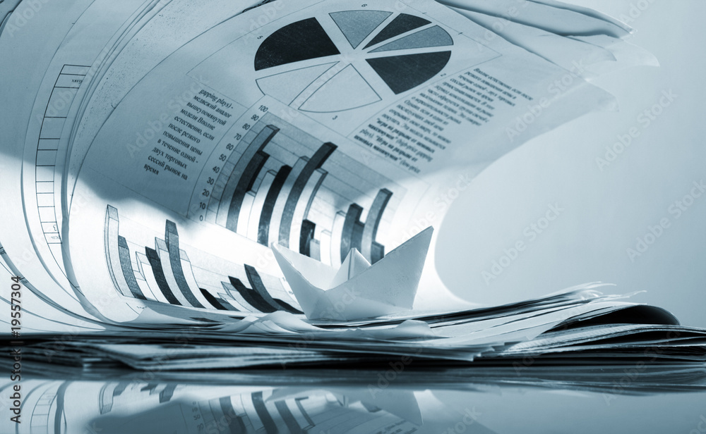 Business concept, paper boat and tsunami documents Business concept, paper boat and tsunami documents