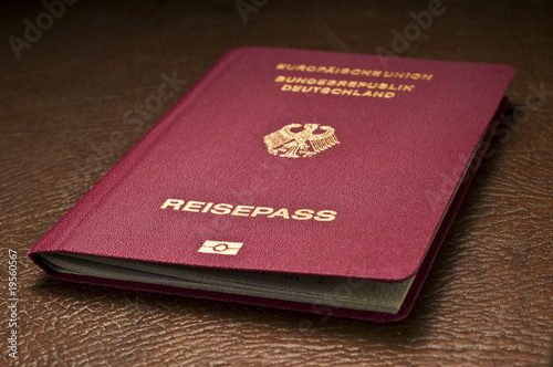 german passport on leather baggage