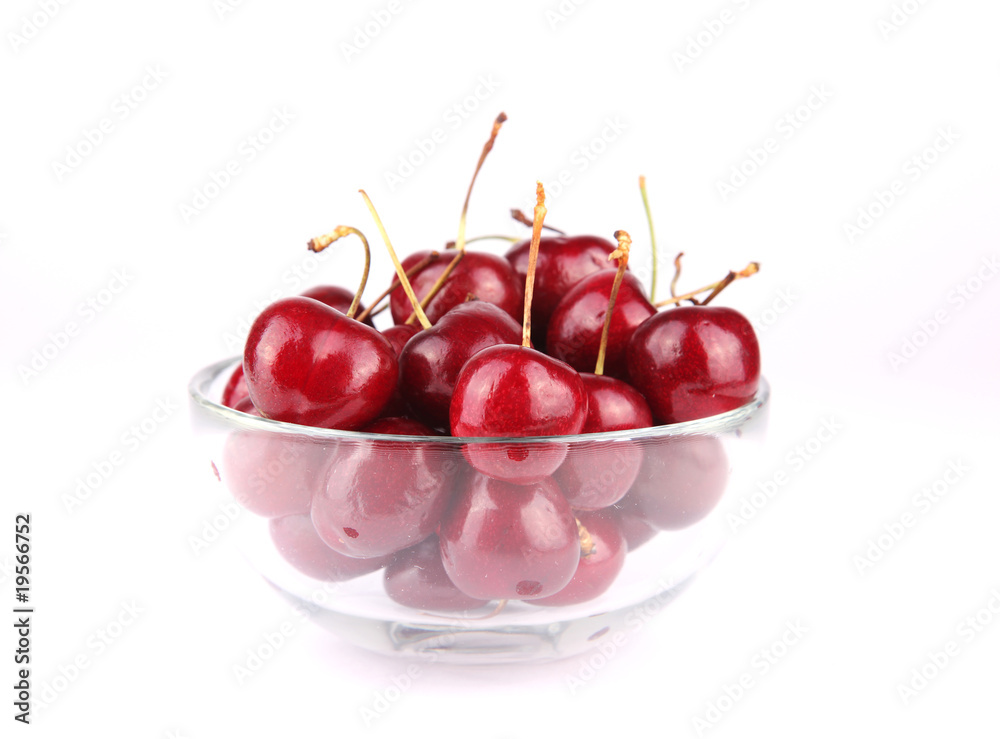 Fresh tasty cherries cherries on glass bowl over Fresh tasty cherries cherries on glass bowl over