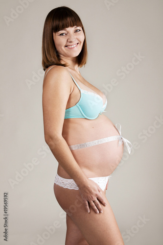 Young beautiful pregnant woman © George Dolgikh