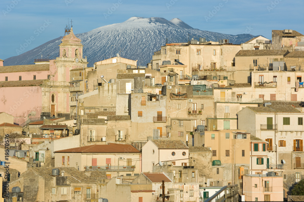 view of village and belltower on background Etna