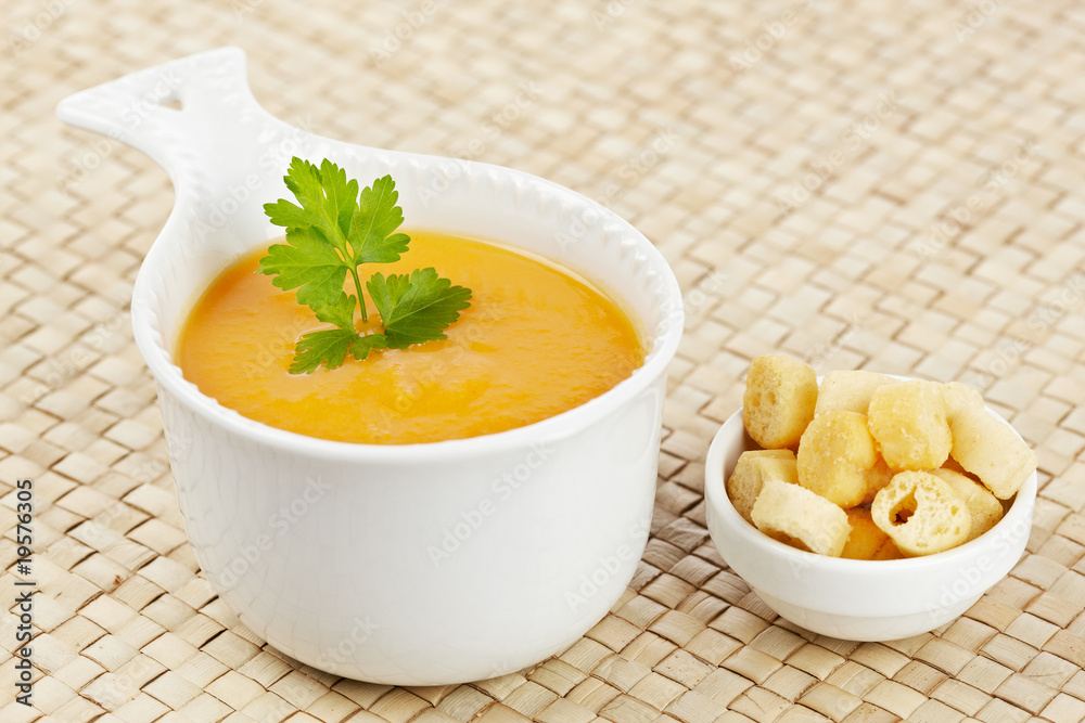 Cream of carrot soup and bread croutons Cream of carrot soup and bread croutons