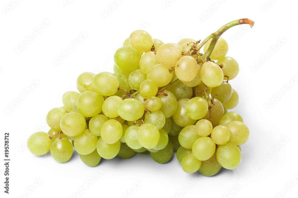 Branch of green grapes on the white background Branch of green grapes on the white background