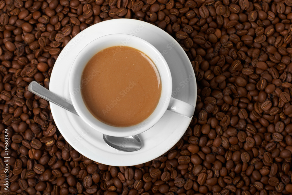 Cup with coffee, costing on coffee grain Cup with coffee, costing on coffee grain